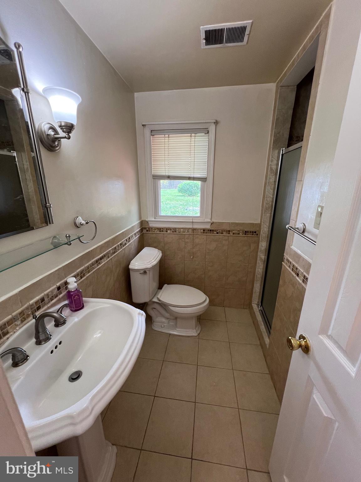 6825 Ridgeway Drive Springfield, VA 22150 - Photo 26 of 33 a bathroom with a sink and a mirror