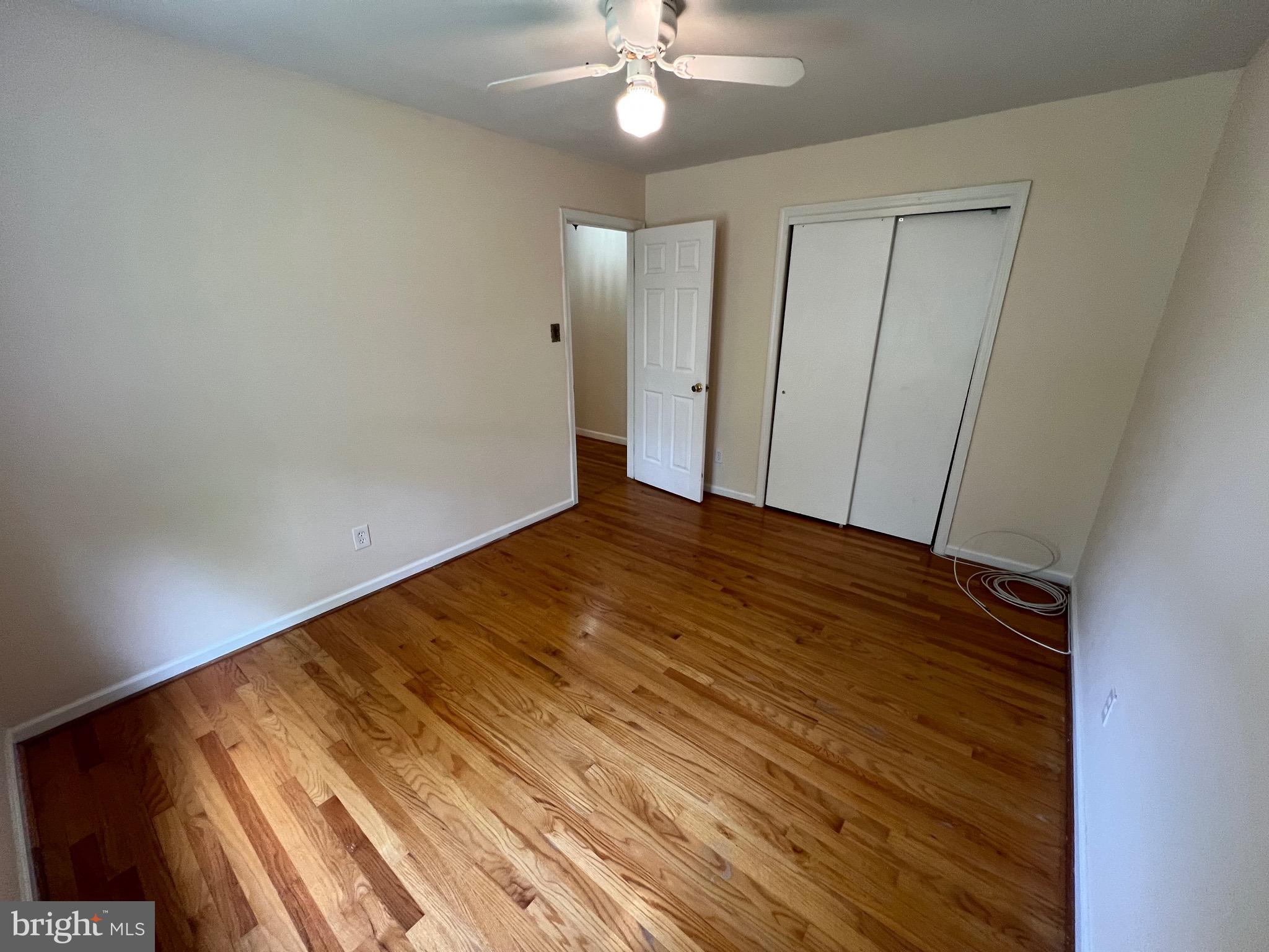6825 Ridgeway Drive Springfield, VA 22150 - Photo 27 of 33 a view of an empty room with wooden floor