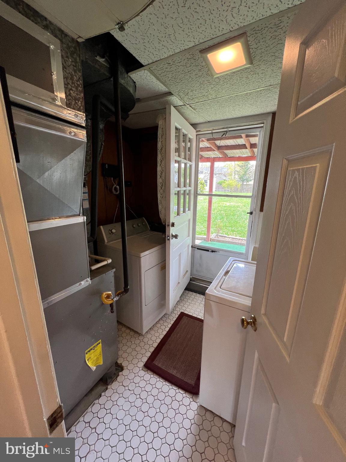 6825 Ridgeway Drive Springfield, VA 22150 - Photo 31 of 33 a view of a door and an empty room with a window