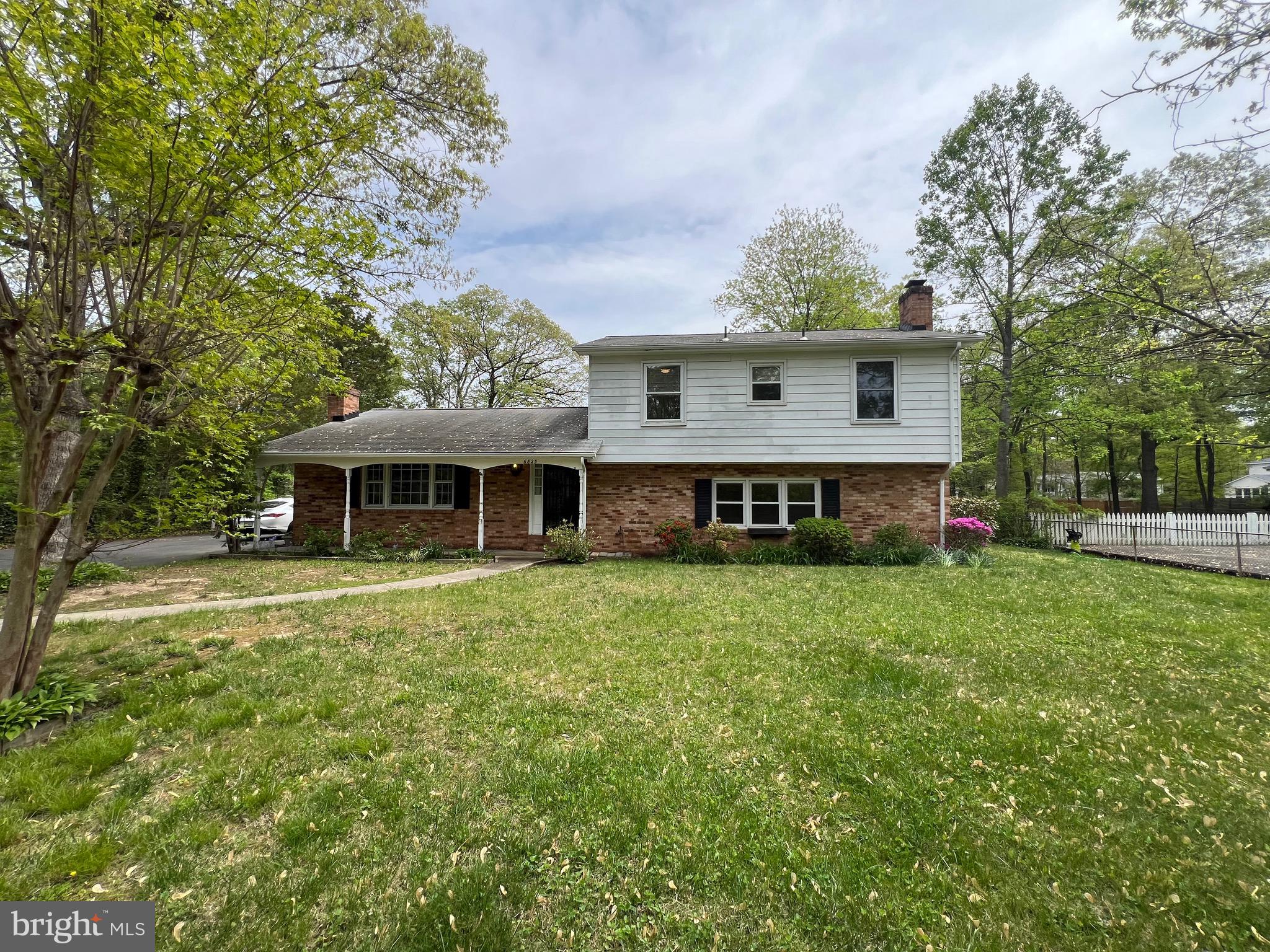 6825 Ridgeway Drive Springfield, VA 22150 - Photo 6 of 33 a front view of a house with garden