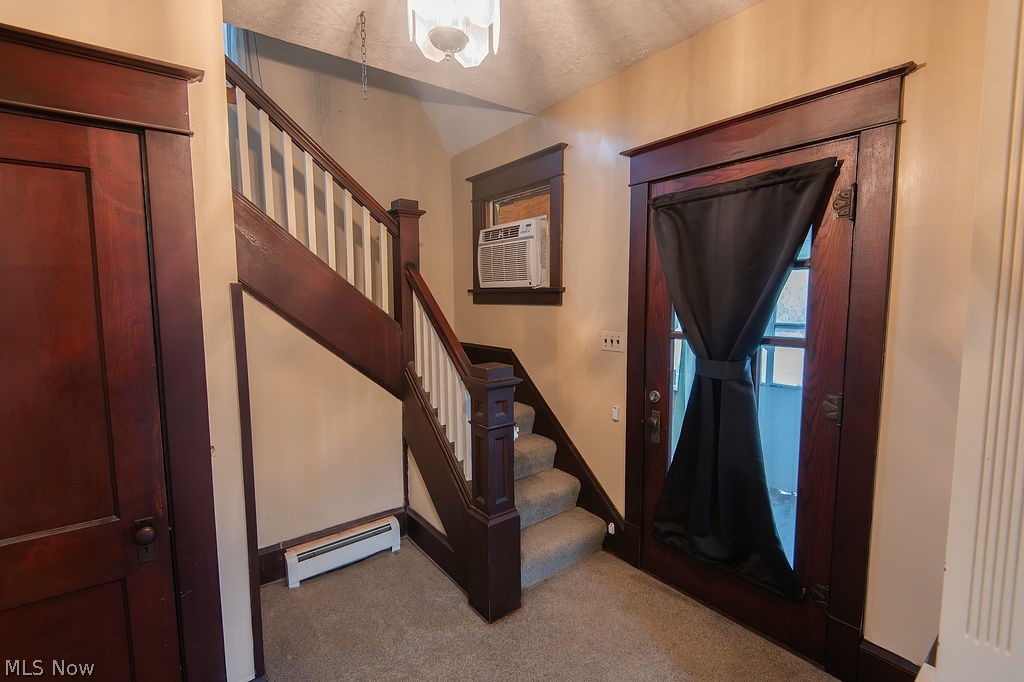 1195 South Johnson Road Sebring, OH 44672 - Photo 15 of 34 Staircase featuring baseboard heating and carpet flooring
