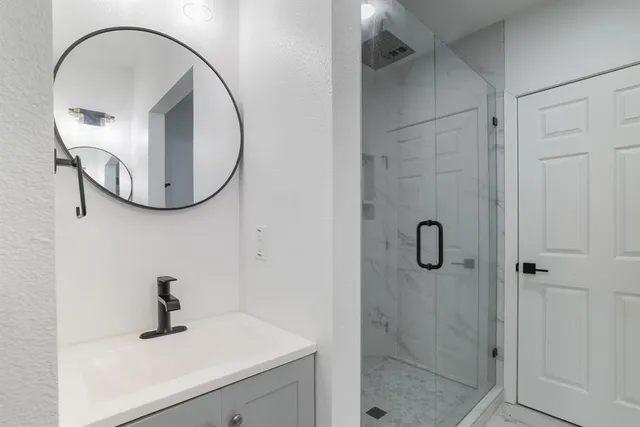 a bathroom with a sink and mirror