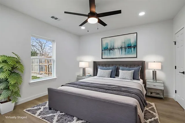 a bedroom with a large bed and a window