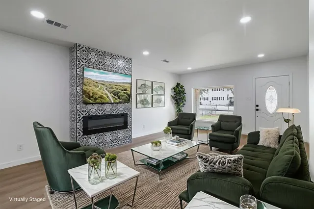 a living room with furniture and a fireplace