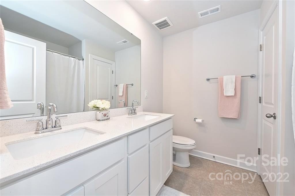 3838 Isenhour Road Kannapolis, NC 28081 - Photo 14 of 17 a bathroom with a sink a toilet and shower