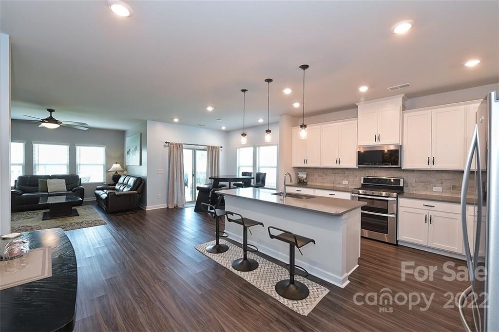 3838 Isenhour Road Kannapolis, NC 28081 - Photo 5 of 17 a kitchen with a sink appliances and cabinets