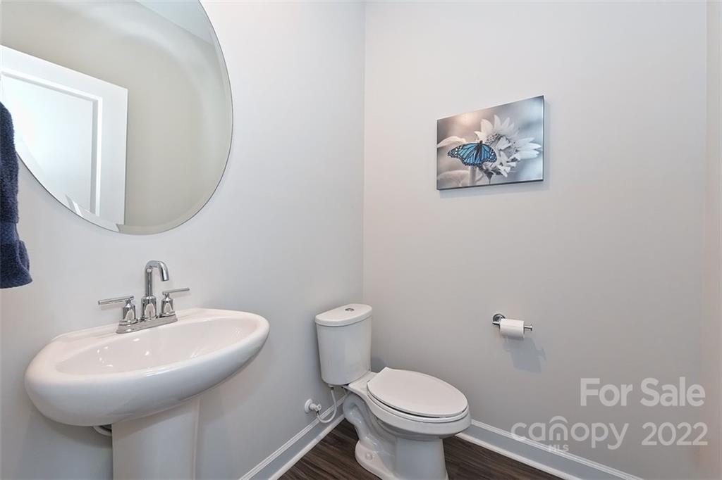3838 Isenhour Road Kannapolis, NC 28081 - Photo 8 of 17 a bathroom with a toilet sink and mirror
