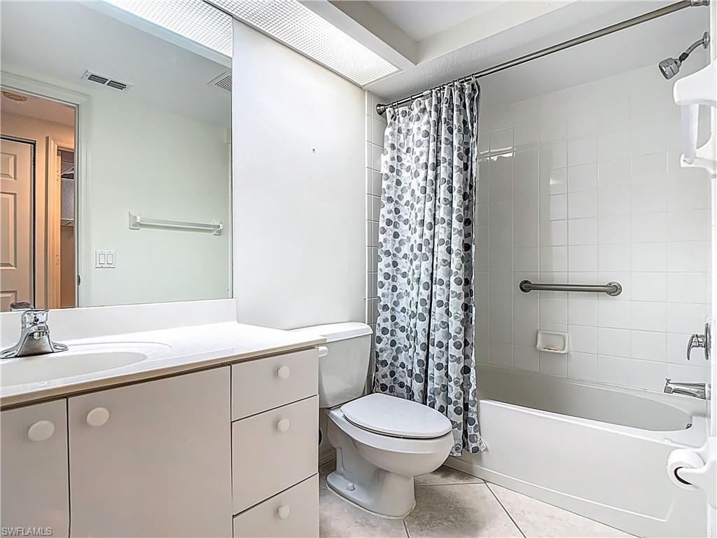 6834 Lantana Bridge Road, Unit 102 Naples, FL 34109 - Photo 24 of 45 a bathroom with a sink a toilet and shower