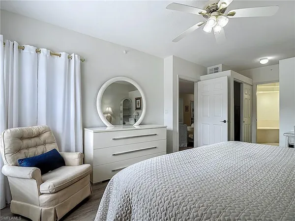 a bathroom with a toilet sink and a mirror