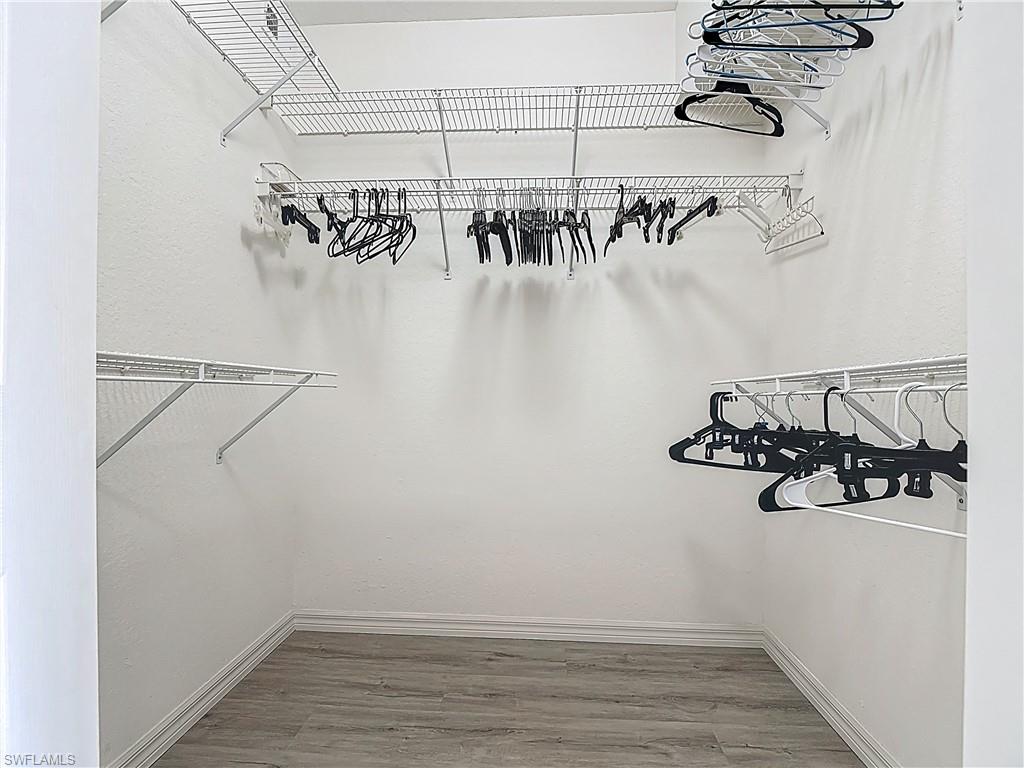 6834 Lantana Bridge Road, Unit 102 Naples, FL 34109 - Photo 33 of 45 a view of a room with racks on the wall