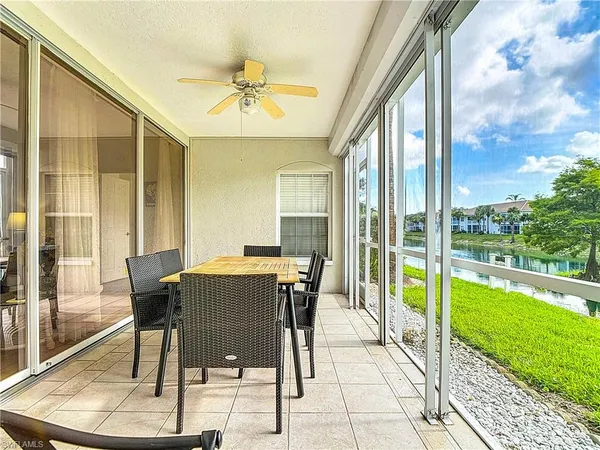 a view of a balcony with table and chairs
