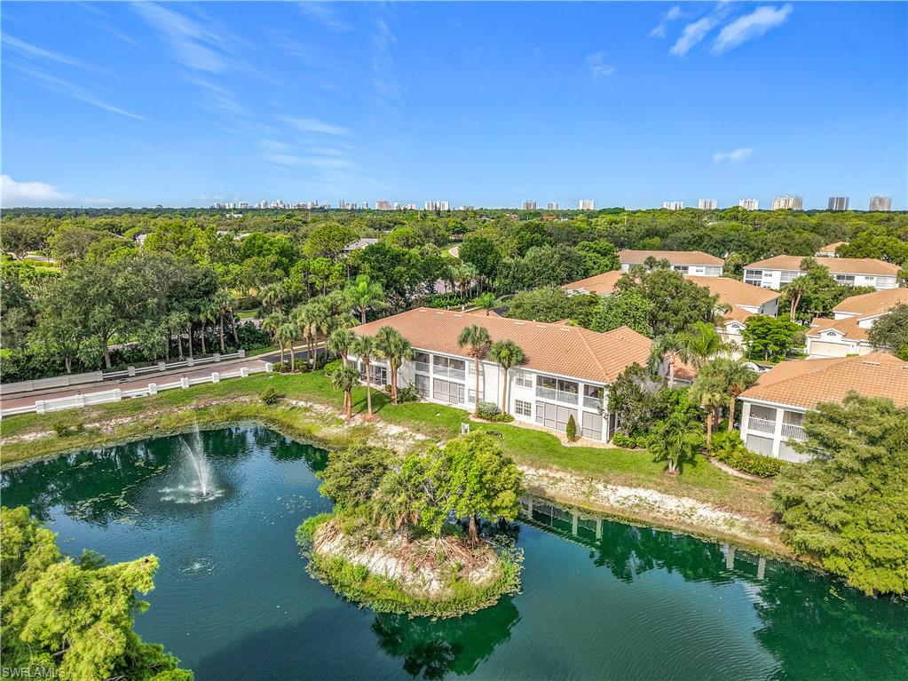 6834 Lantana Bridge Road, Unit 102 Naples, FL 34109 - Photo 45 of 45 an aerial view of residential houses with outdoor space and swimming pool