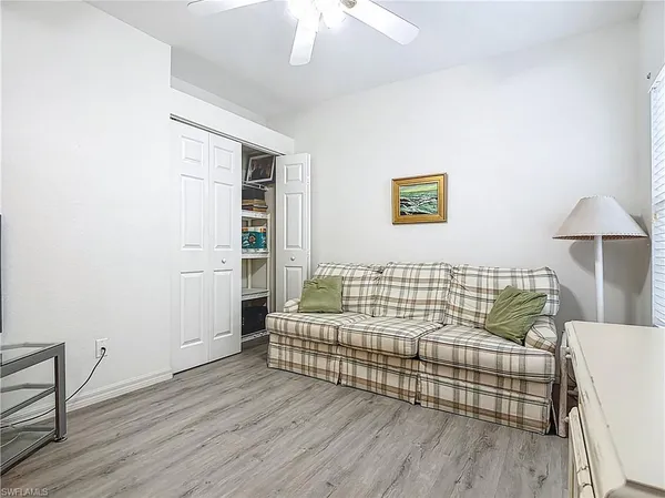 a bedroom with furniture and wooden floor
