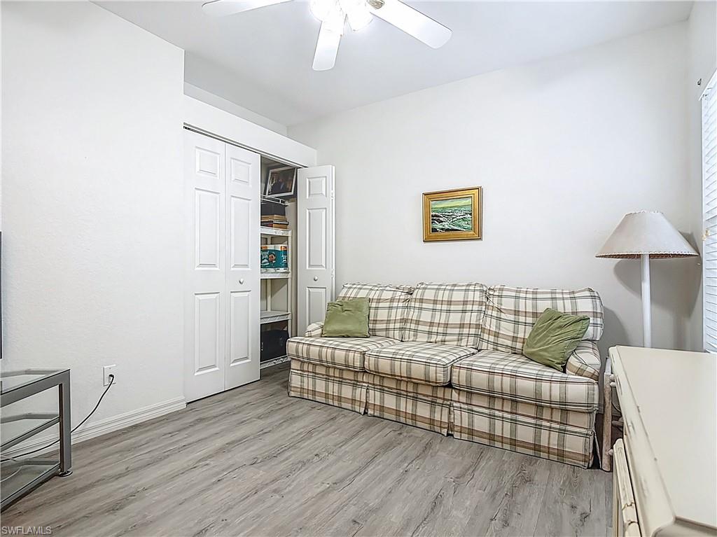 6834 Lantana Bridge Road, Unit 102 Naples, FL 34109 - Photo 5 of 45 a bedroom with a bed and a table