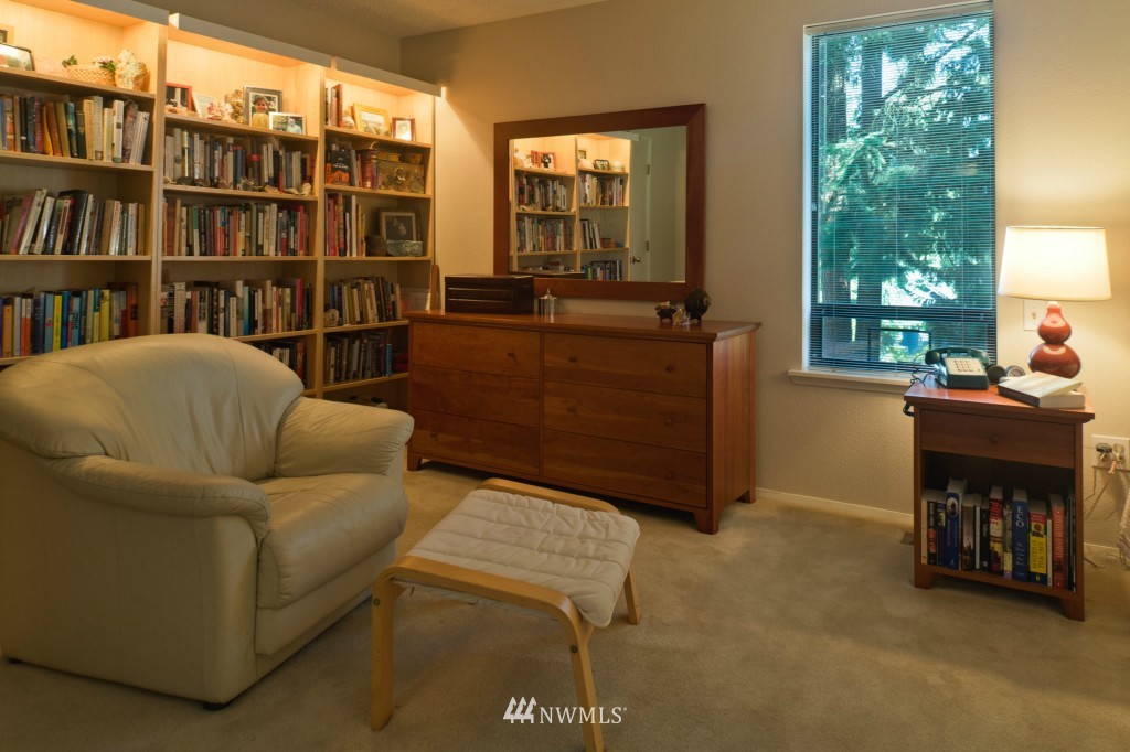 621 Canyon View Road Bellingham, WA 98225 - Photo 12 of 15 a living room with furniture a bookshelf and a large window