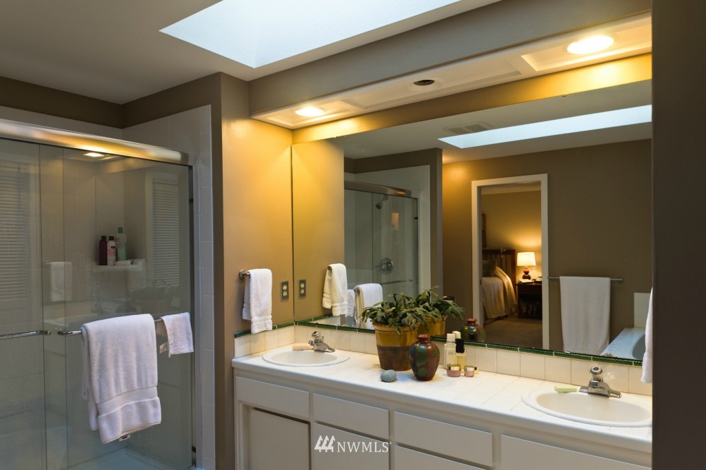 621 Canyon View Road Bellingham, WA 98225 - Photo 13 of 15 a bathroom with a sink a mirror and shower