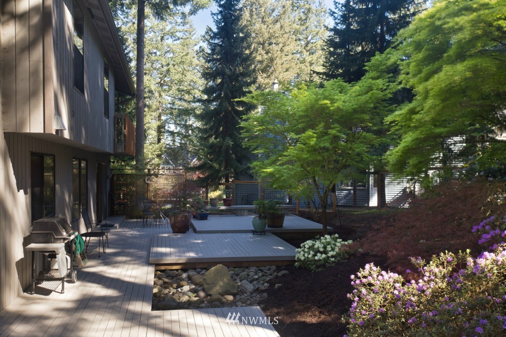 621 Canyon View Road Bellingham, WA 98225 - Photo 14 of 15 a view of a patio with table and chairs and potted plants