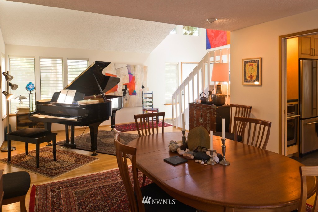 621 Canyon View Road Bellingham, WA 98225 - Photo 3 of 15 a living room with furniture a large window and a potted plant