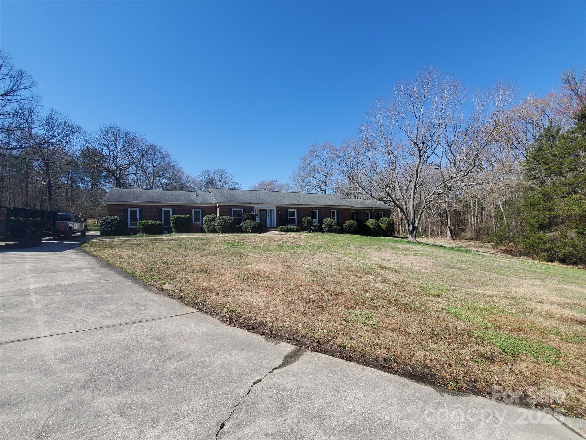 10843 Caroline Acres Road Fort Mill, SC 29707 - Photo 3 of 34 a front view of house with yard and trees in the background