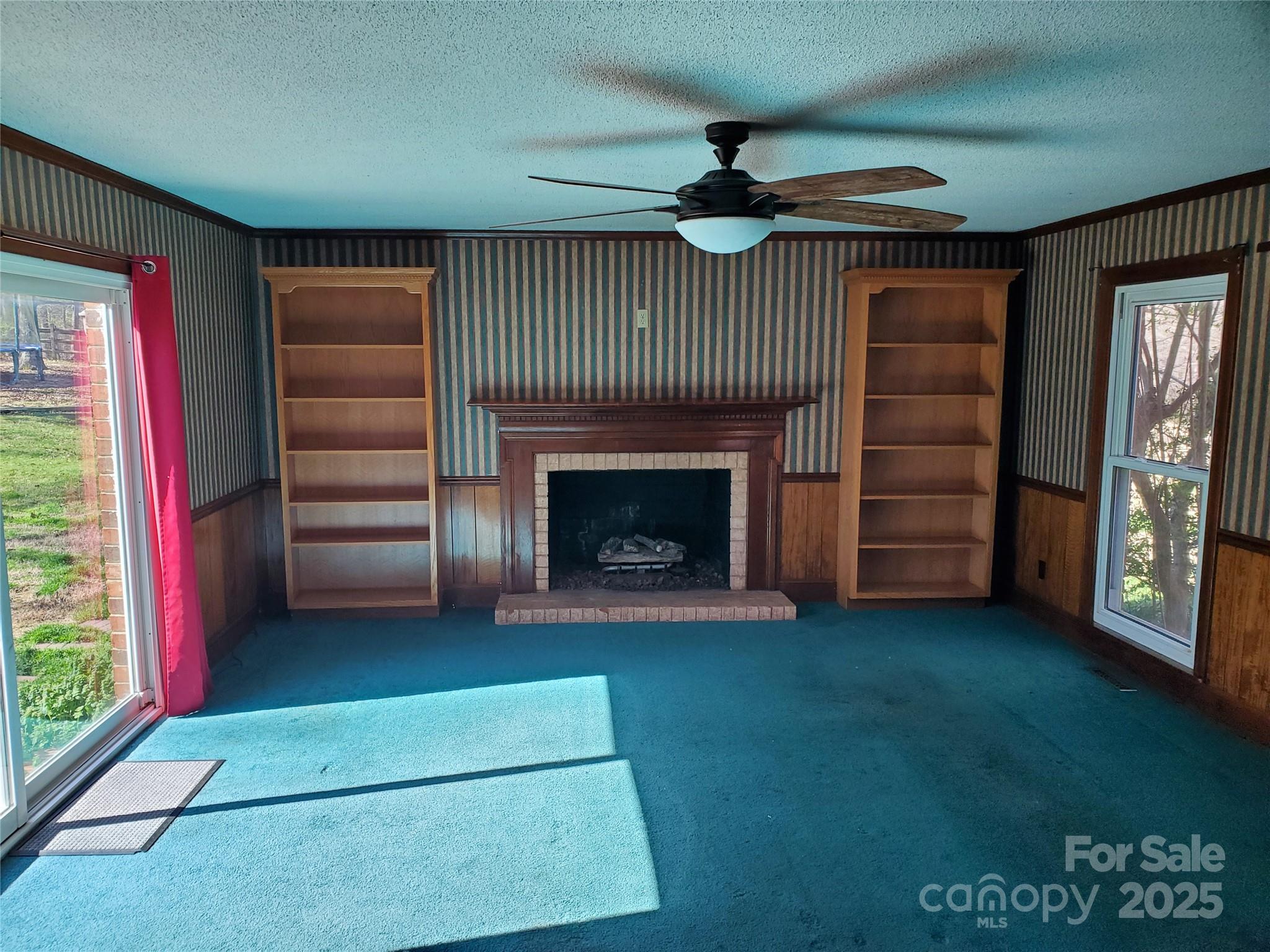 10843 Caroline Acres Road Fort Mill, SC 29707 - Photo 33 of 34 wooden floor in an empty room with a fireplace