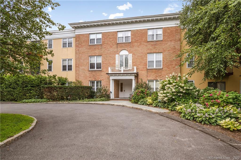 140 Field Point Road, Unit 37 Greenwich, CT 06830 - Photo 1 of 1 a front view of a house with a garden