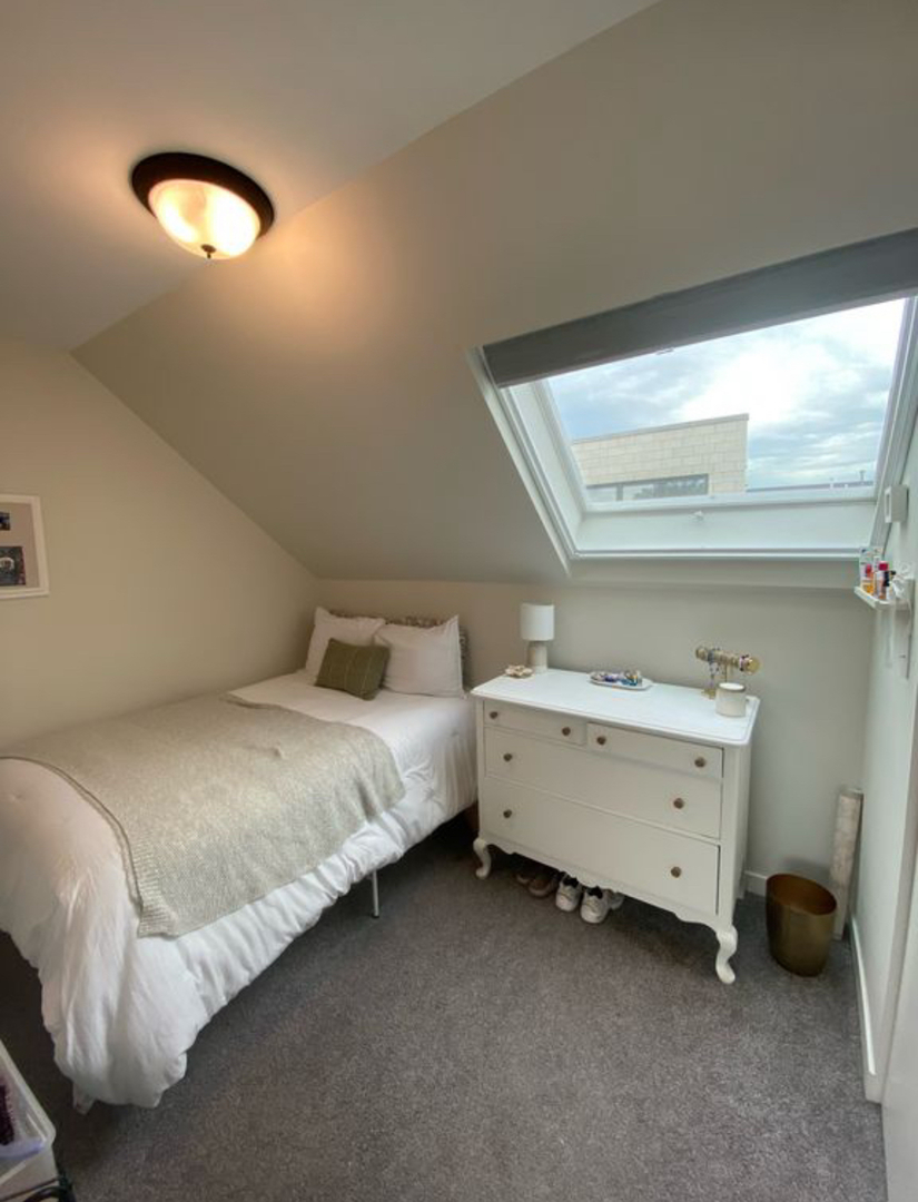 1644 North Hermitage Avenue, Unit 2R Chicago, IL 60622 - Photo 15 of 18 a bedroom with a bed and a chandelier