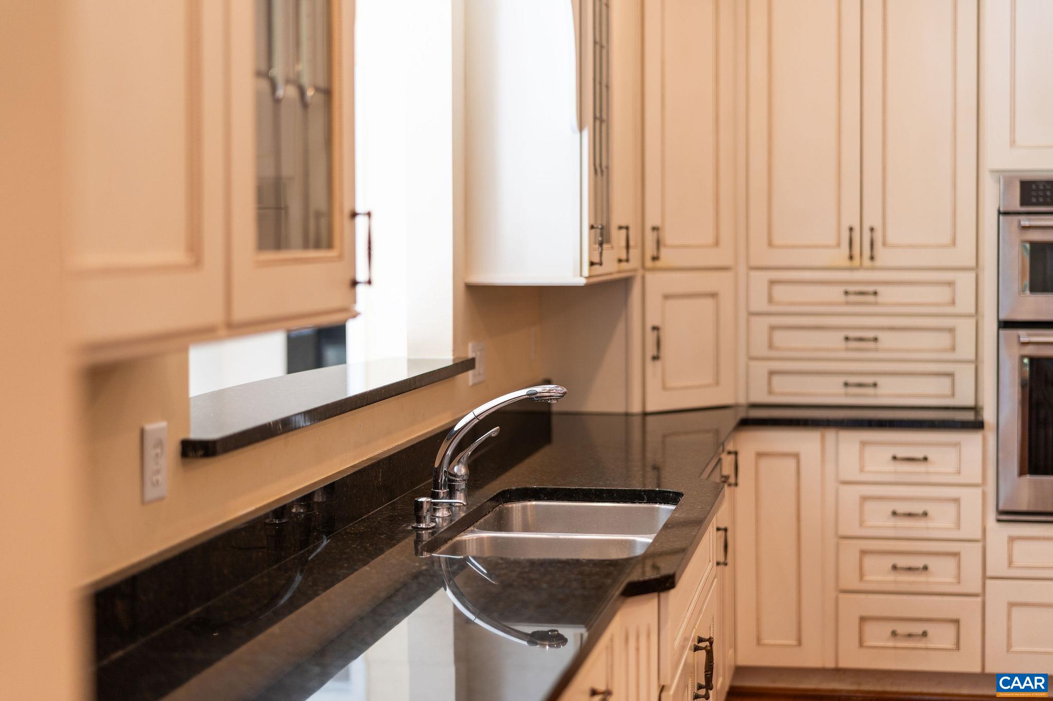21 Amethyst Road Palmyra, VA 22963 - Photo 14 of 66 a kitchen with granite countertop a sink and a stove