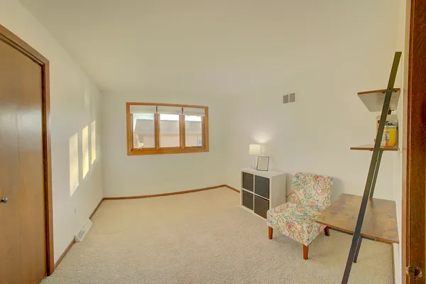 a view of an empty room with windows