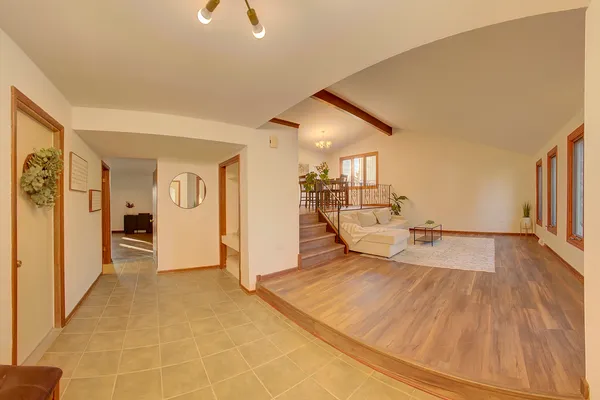 a view of a living room hardwood floor and a ceiling fan