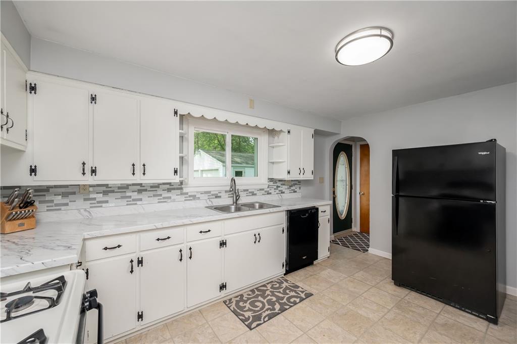 3263 Hubbard-Middlesex Road West Middlesex, PA 16159 - Photo 2 of 21 a kitchen with granite countertop a refrigerator and a stove top oven