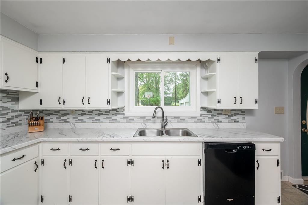 3263 Hubbard-Middlesex Road West Middlesex, PA 16159 - Photo 3 of 21 a kitchen with granite countertop a sink and cabinets