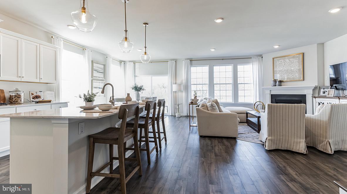 213 Ferrell Road Mullica Hill, NJ 08062 - Photo 13 of 50 a kitchen with counter space dining table and stainless steel appliances
