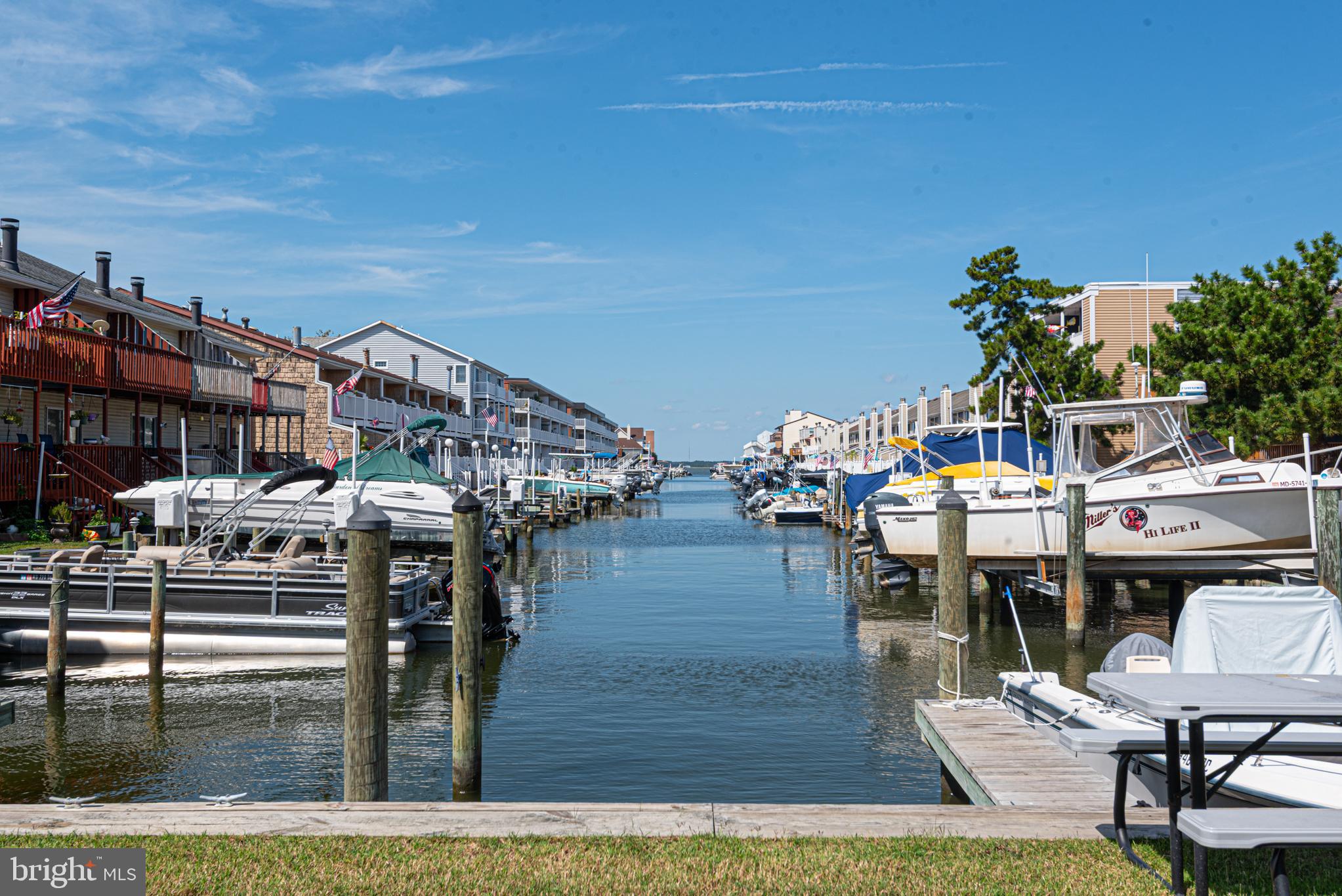 9203 Rusty Anchor Road, Unit A5 Ocean City, MD 21842 - Photo 3 of 60 a view of a chairs and table on the terrace