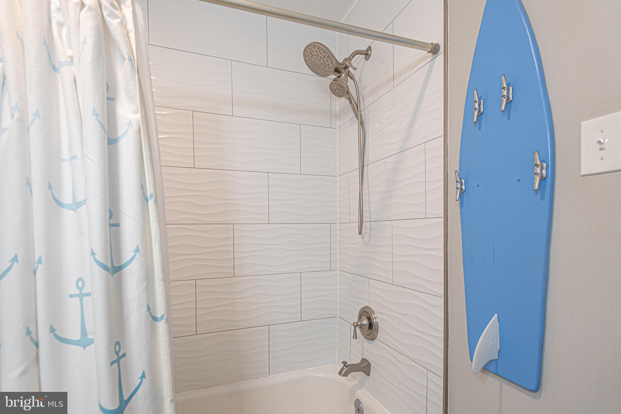 9203 Rusty Anchor Road, Unit A5 Ocean City, MD 21842 - Photo 40 of 60 a bathroom with a shower