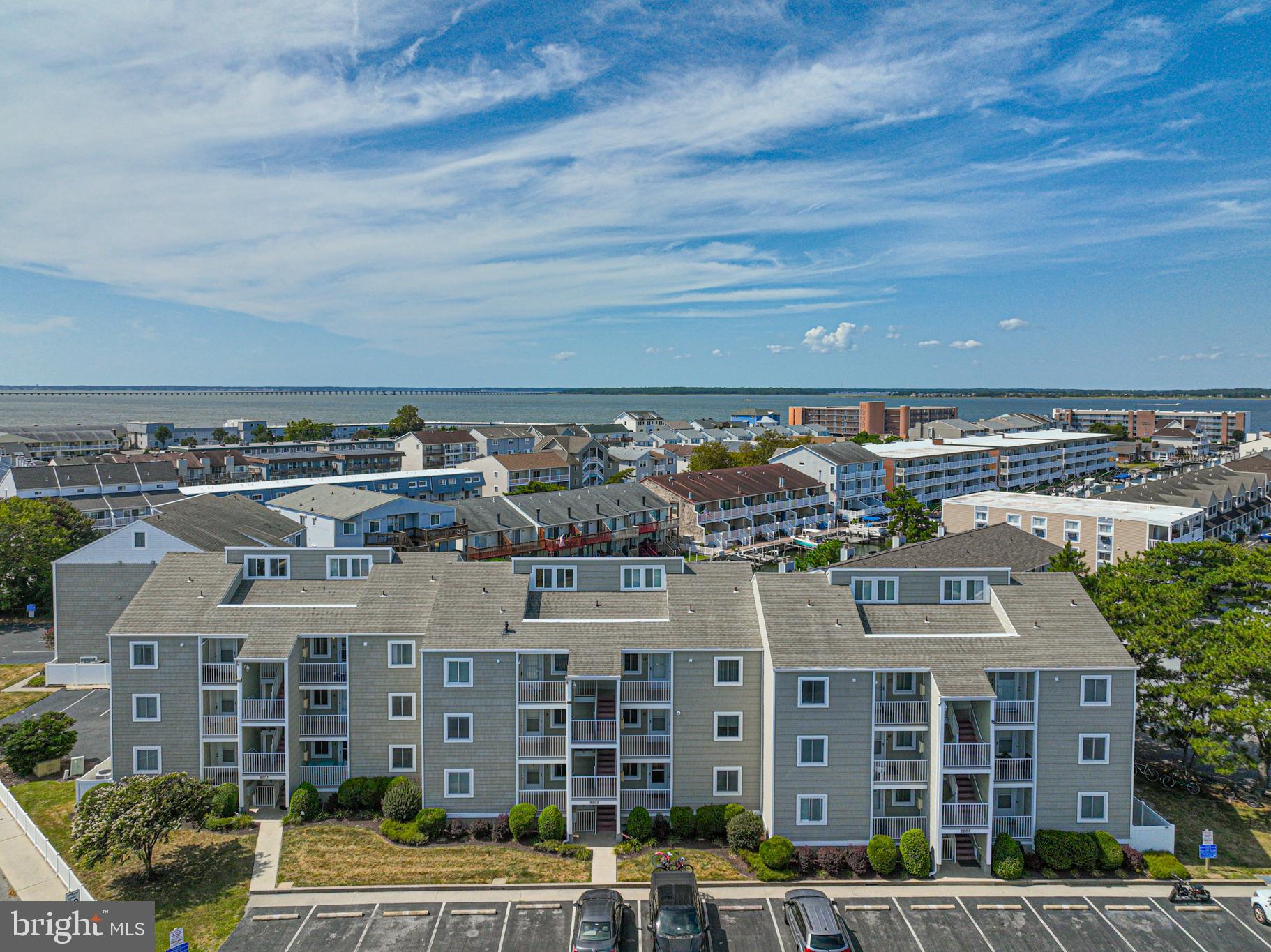 9203 Rusty Anchor Road, Unit A5 Ocean City, MD 21842 - Photo 54 of 60 a view of a large building with a city view