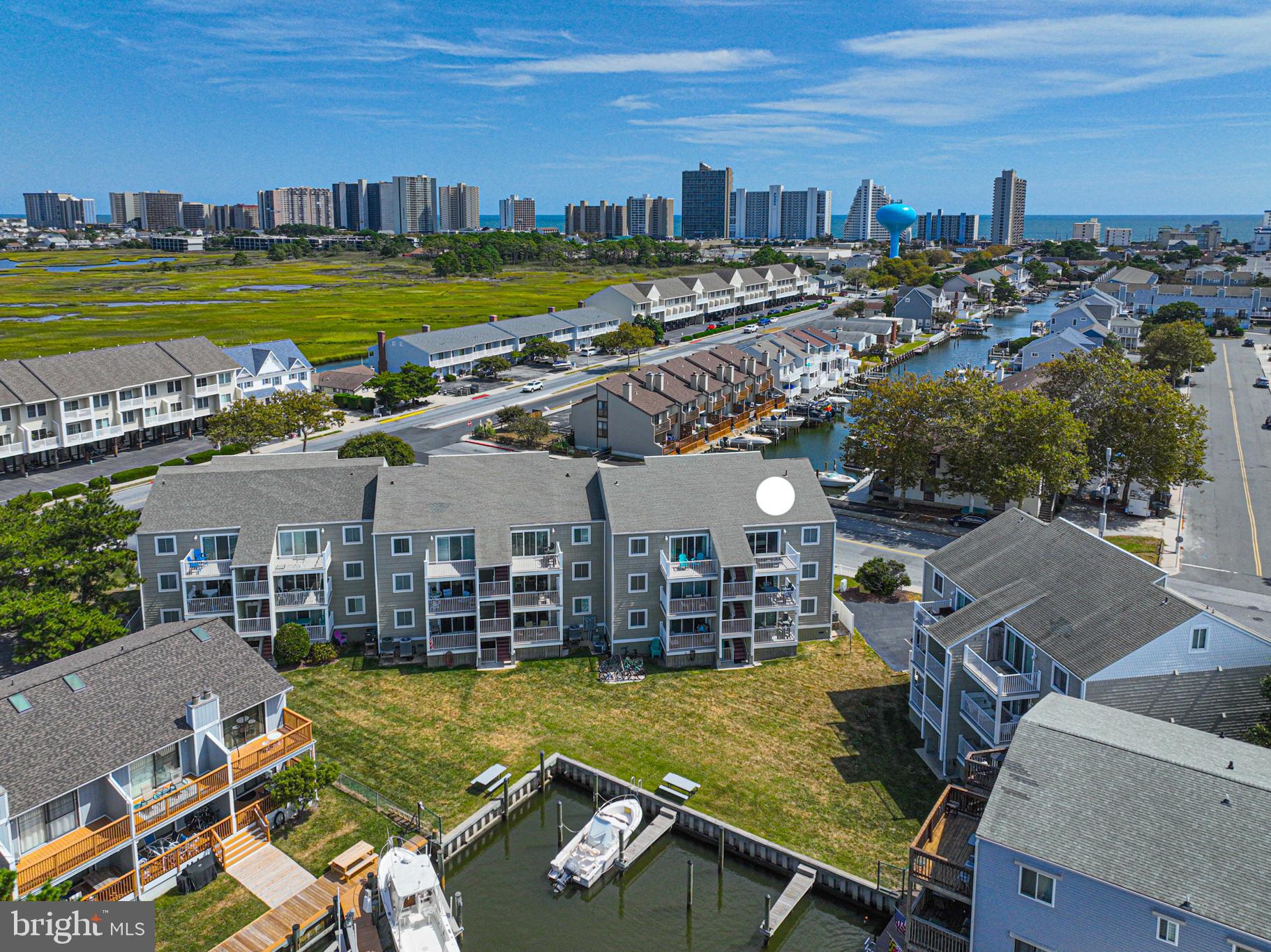 9203 Rusty Anchor Road, Unit A5 Ocean City, MD 21842 - Photo 59 of 60 a view of a swimming pool and lounge chairs