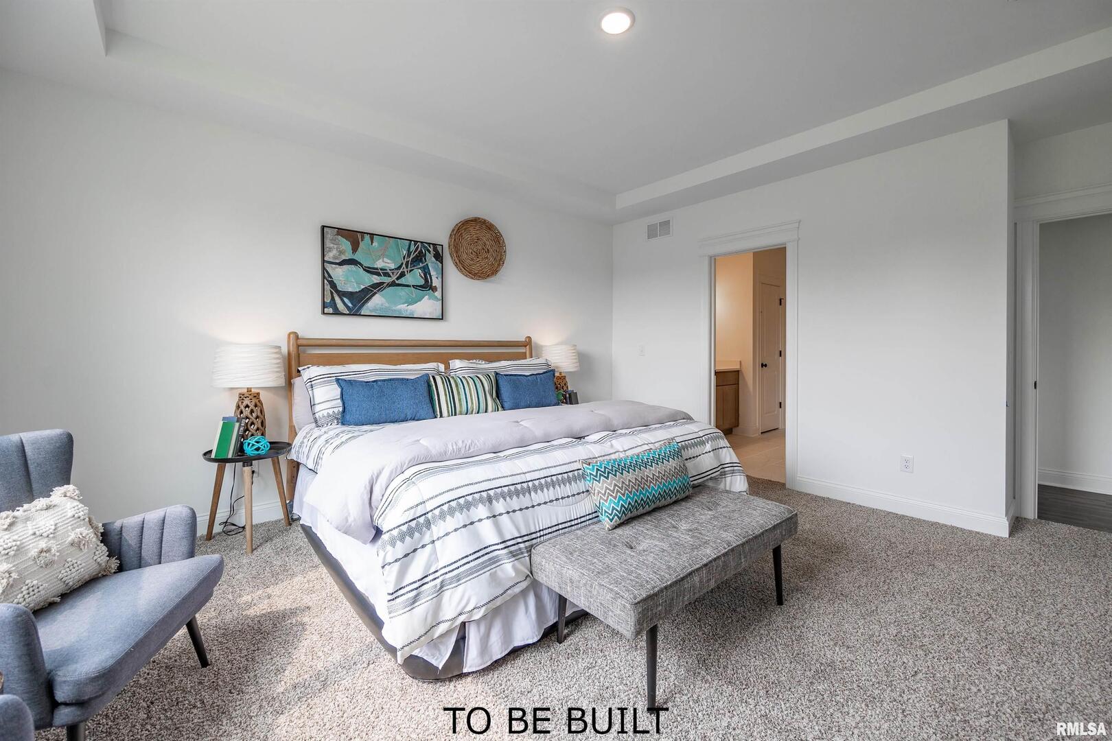 10 South 5th Street Eldridge, IA 52748 - Photo 16 of 29 a bedroom with a bed and couch