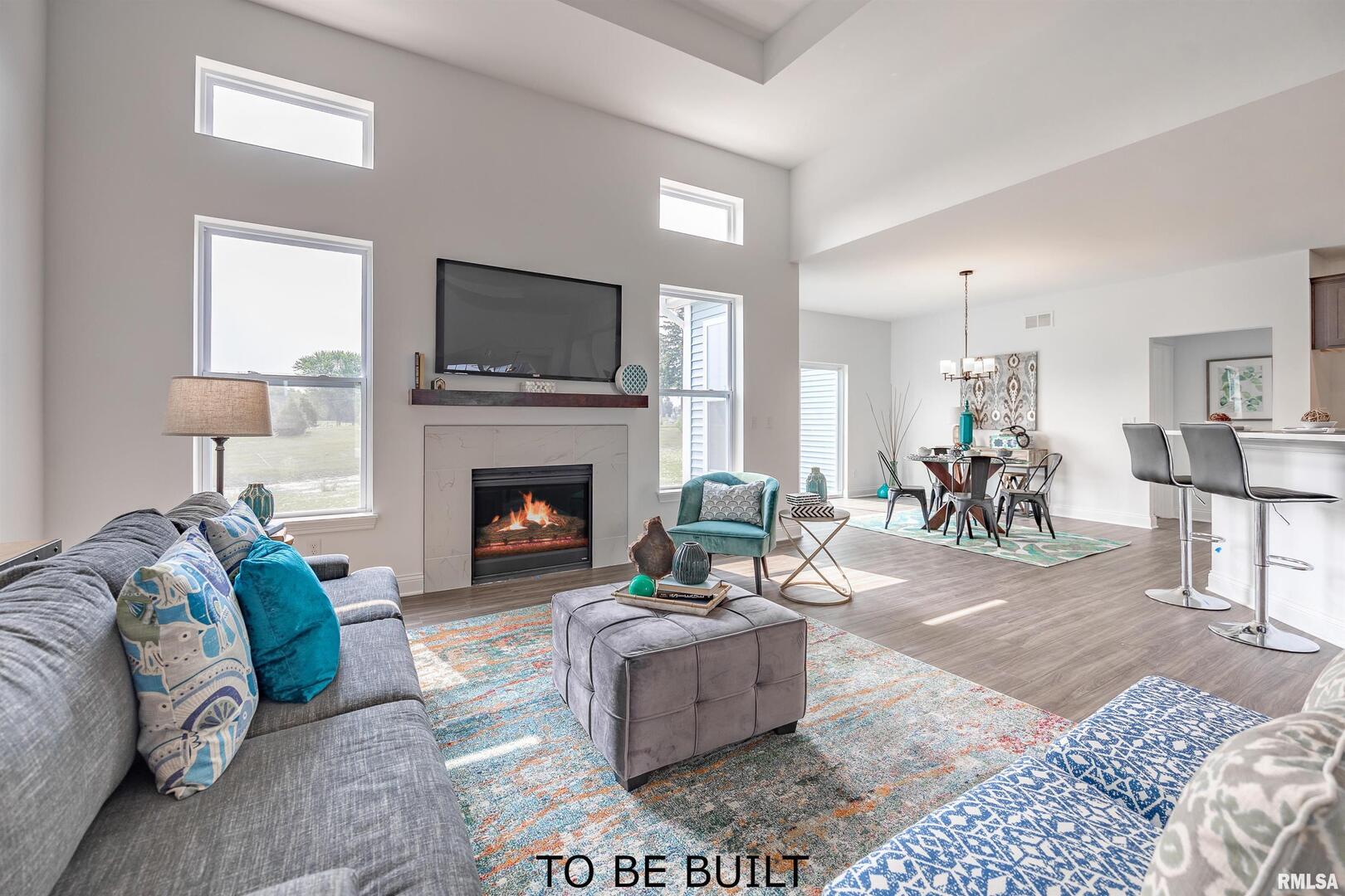 10 South 5th Street Eldridge, IA 52748 - Photo 4 of 29 a living room with furniture and a fireplace