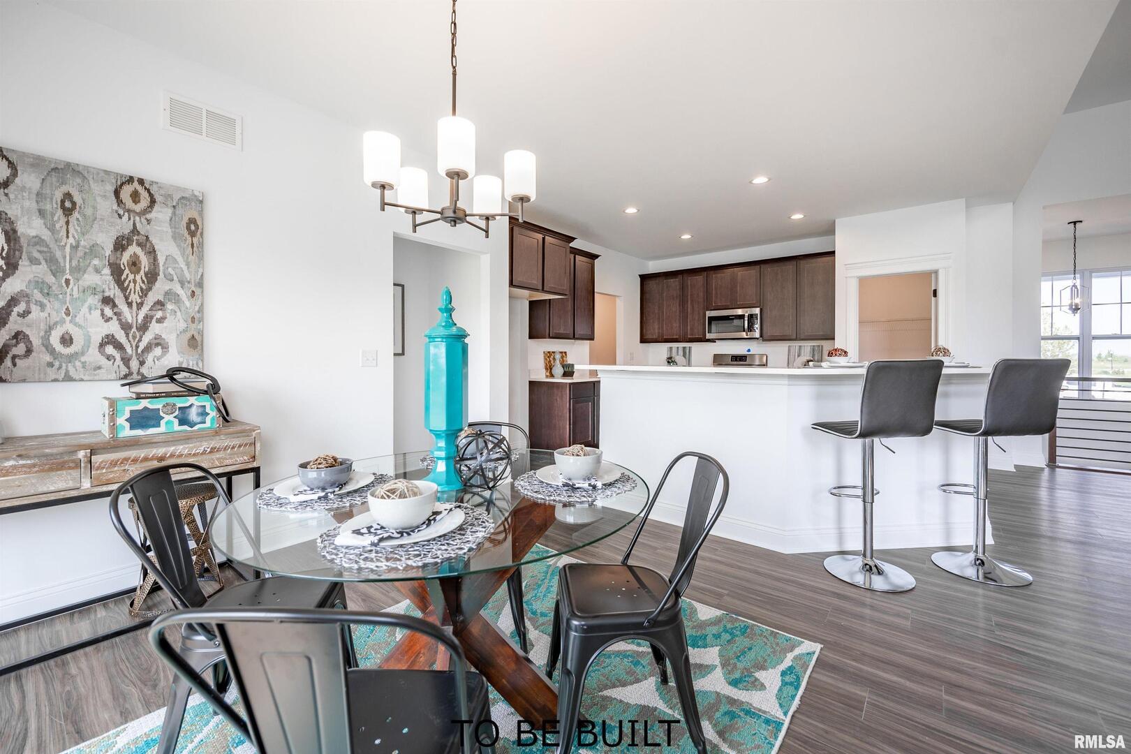 10 South 5th Street Eldridge, IA 52748 - Photo 6 of 29 a view of a dining room with furniture