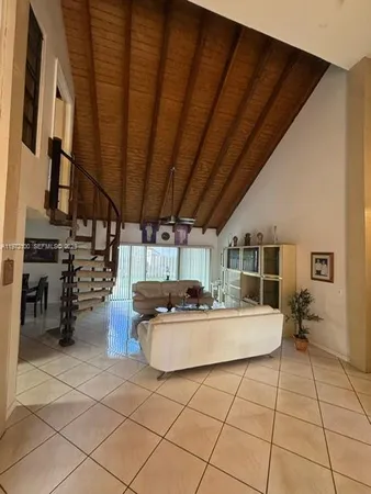 a kitchen with stainless steel appliances kitchen island granite countertop a sink and cabinets