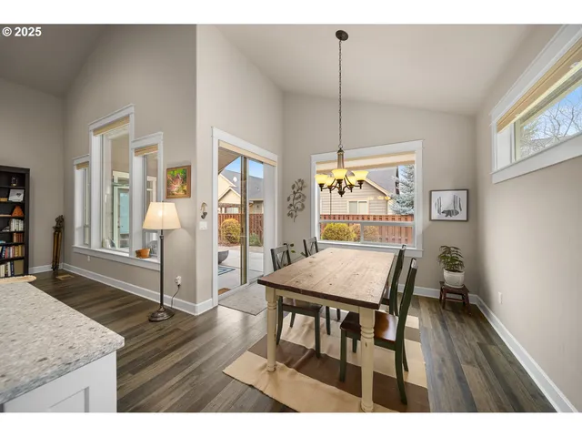 a view of a livingroom with furniture window and wooden floor