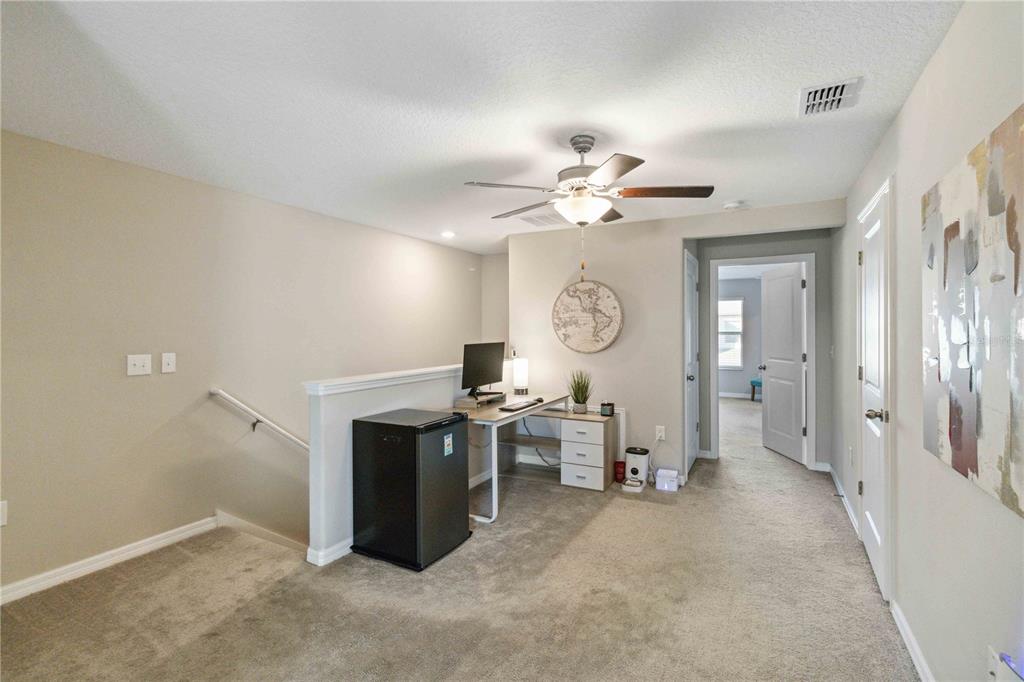 14339 Easy Goer Street Ruskin, FL 33573 - Photo 24 of 49 wooden floor in an empty room with a window