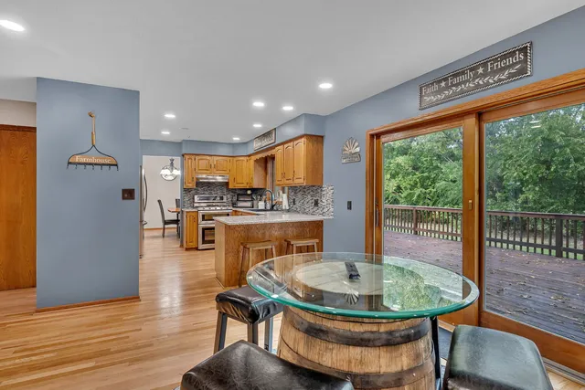 a view of a dining room with furniture window and wooden floor