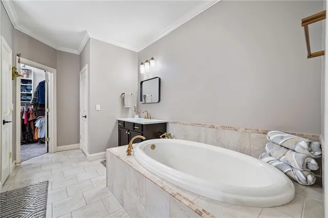 a bathroom with a bathtub and sink