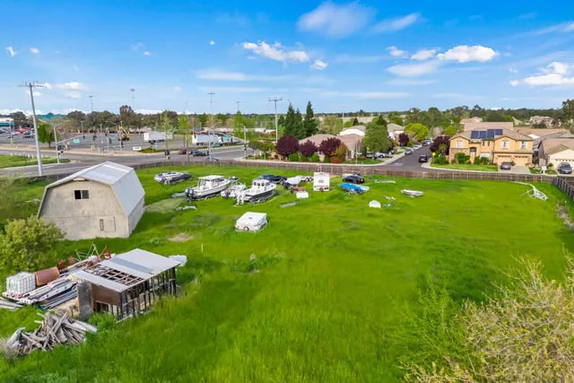 a view of a golf course with a house