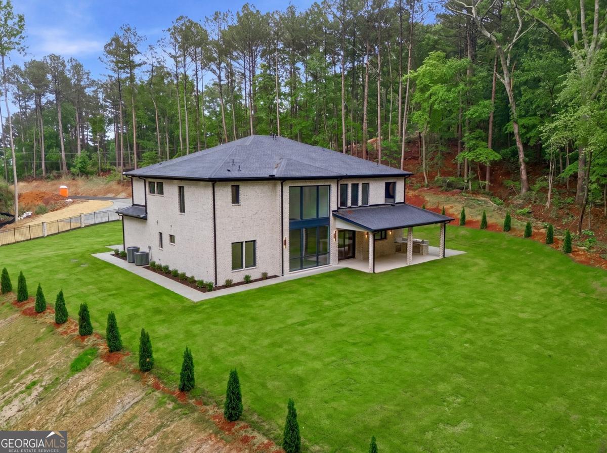 1563 Whitley Road Bethlehem, GA 30620 - Photo 43 of 44 a view of a house with backyard and a garden