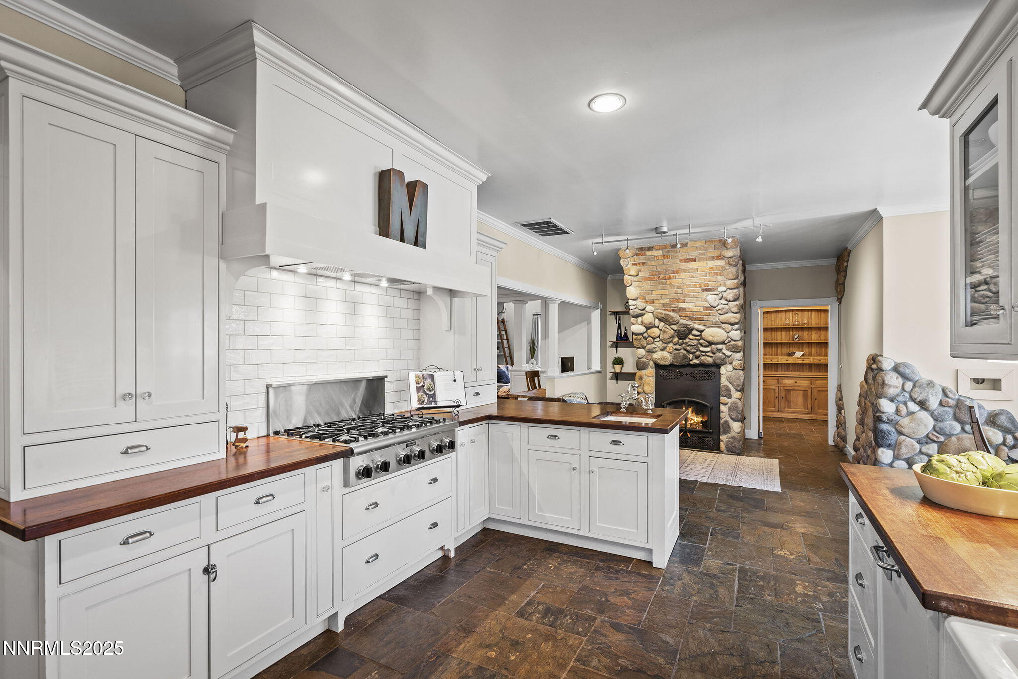 5 Connie Way Reno, NV 89521 - Photo 14 of 54 a large kitchen with granite countertop a sink and cabinets