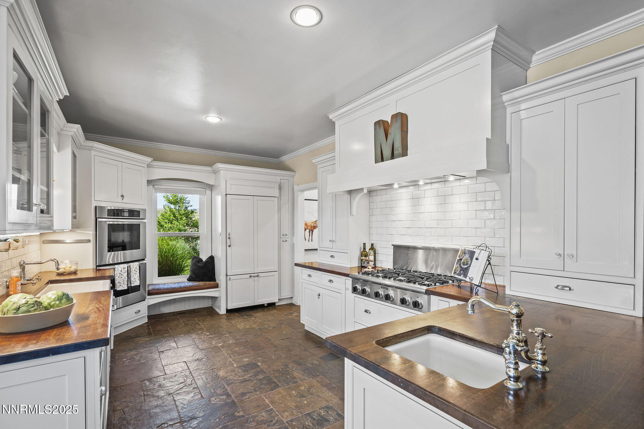 5 Connie Way Reno, NV 89521 - Photo 16 of 54 a kitchen with granite countertop a sink stove and cabinets