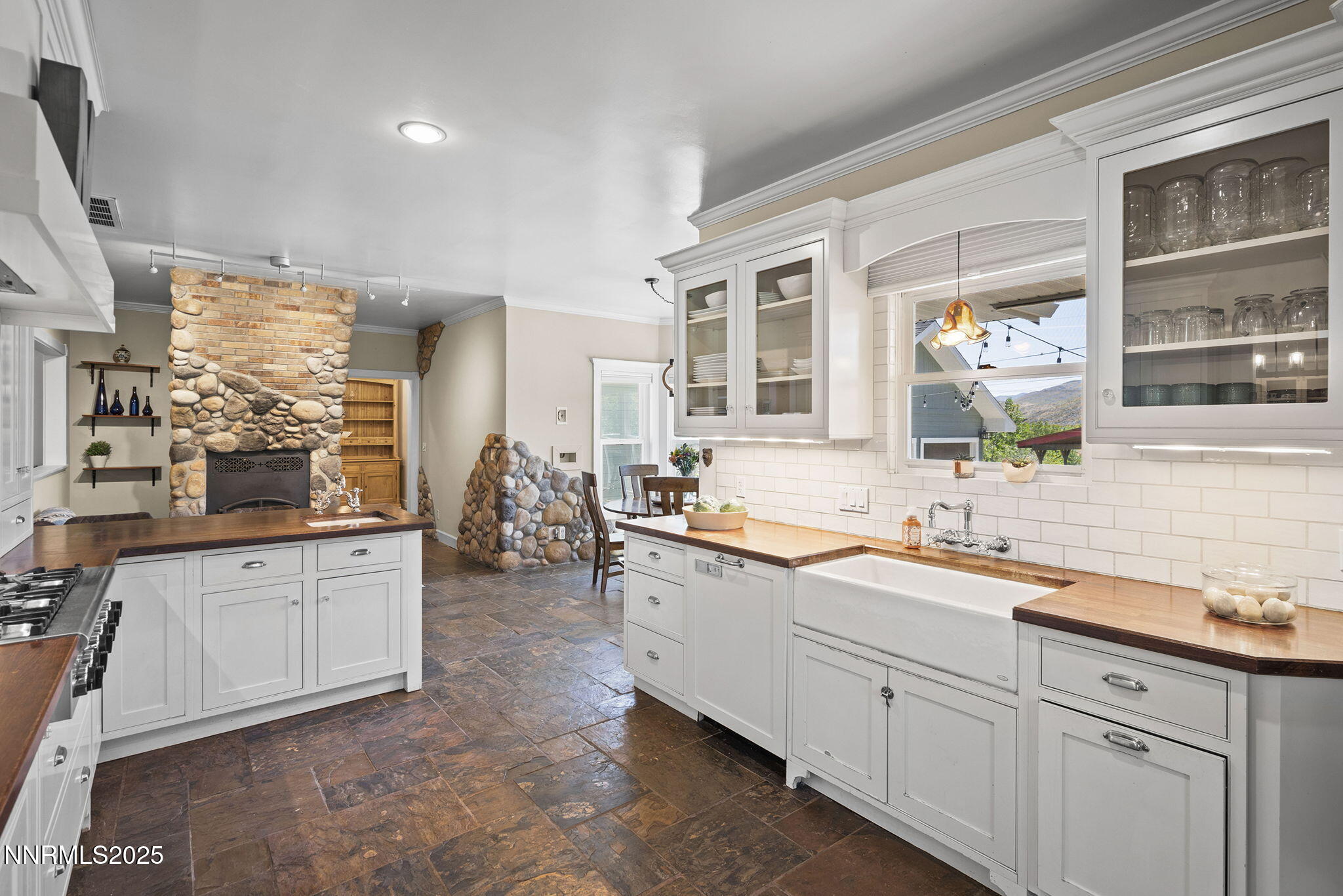 5 Connie Way Reno, NV 89521 - Photo 18 of 54 a large white kitchen with granite countertop a sink and dishwasher a stove with wooden cabinets