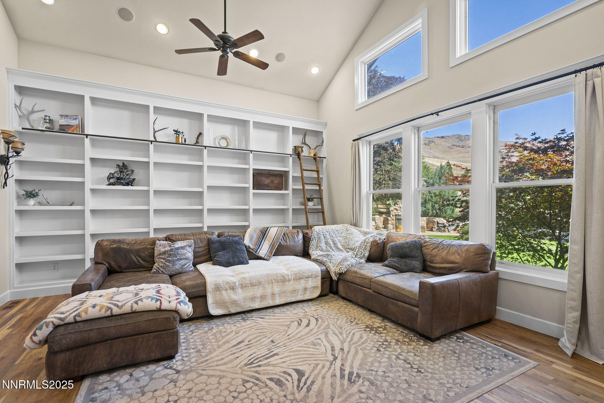 5 Connie Way Reno, NV 89521 - Photo 22 of 54 a living room with furniture and a large window with kitchen view